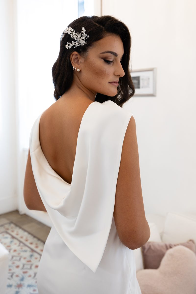 Trunk Show Nagae Bridal: dettaglio della schiena drappeggiata di un abito da sposa